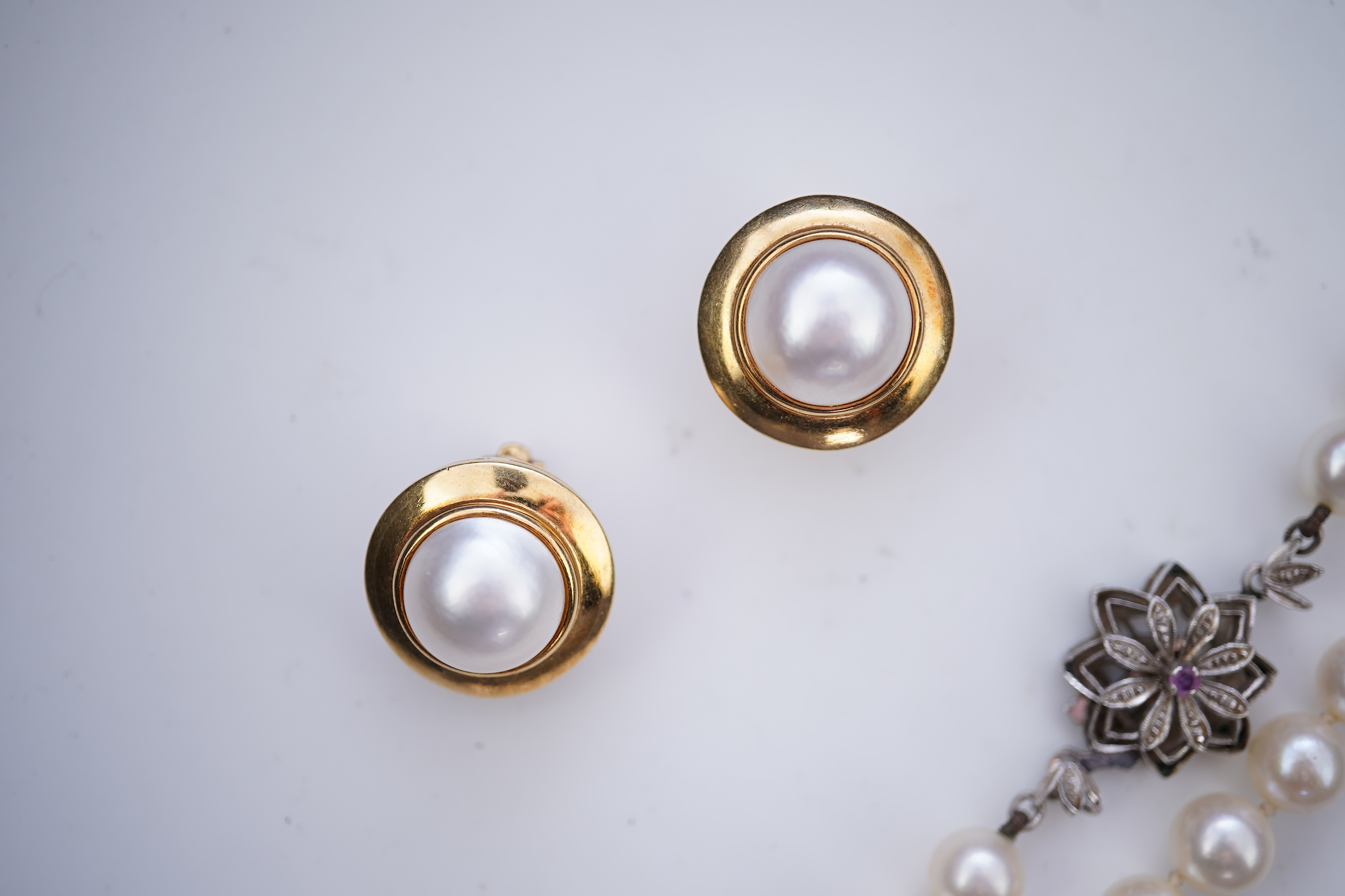 A cultured pearl necklace and pair of mabé cultured pearl ear clips